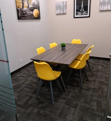 4 people meeting room 368x400 Conference room with yellow chairs and a table.