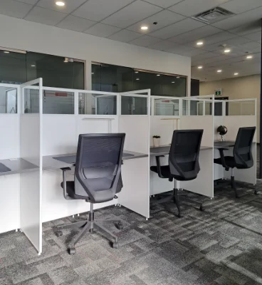 coworking flexdesks oshawa 368x400 Modern office space with cubicles and chairs.