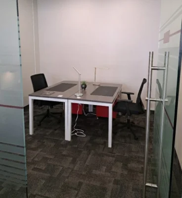 semi private office 368x400 Modern office space with desk and chairs.